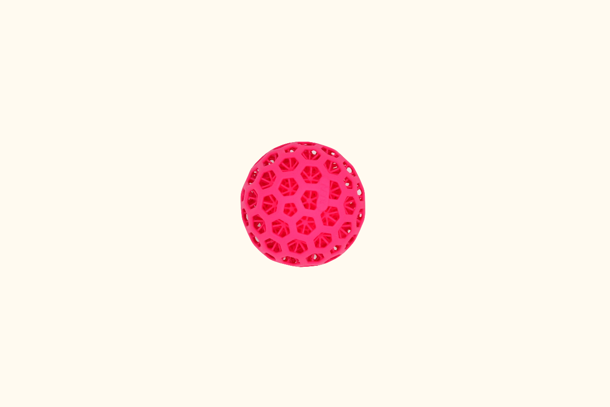 Pink circular ball with a pattern on a white background